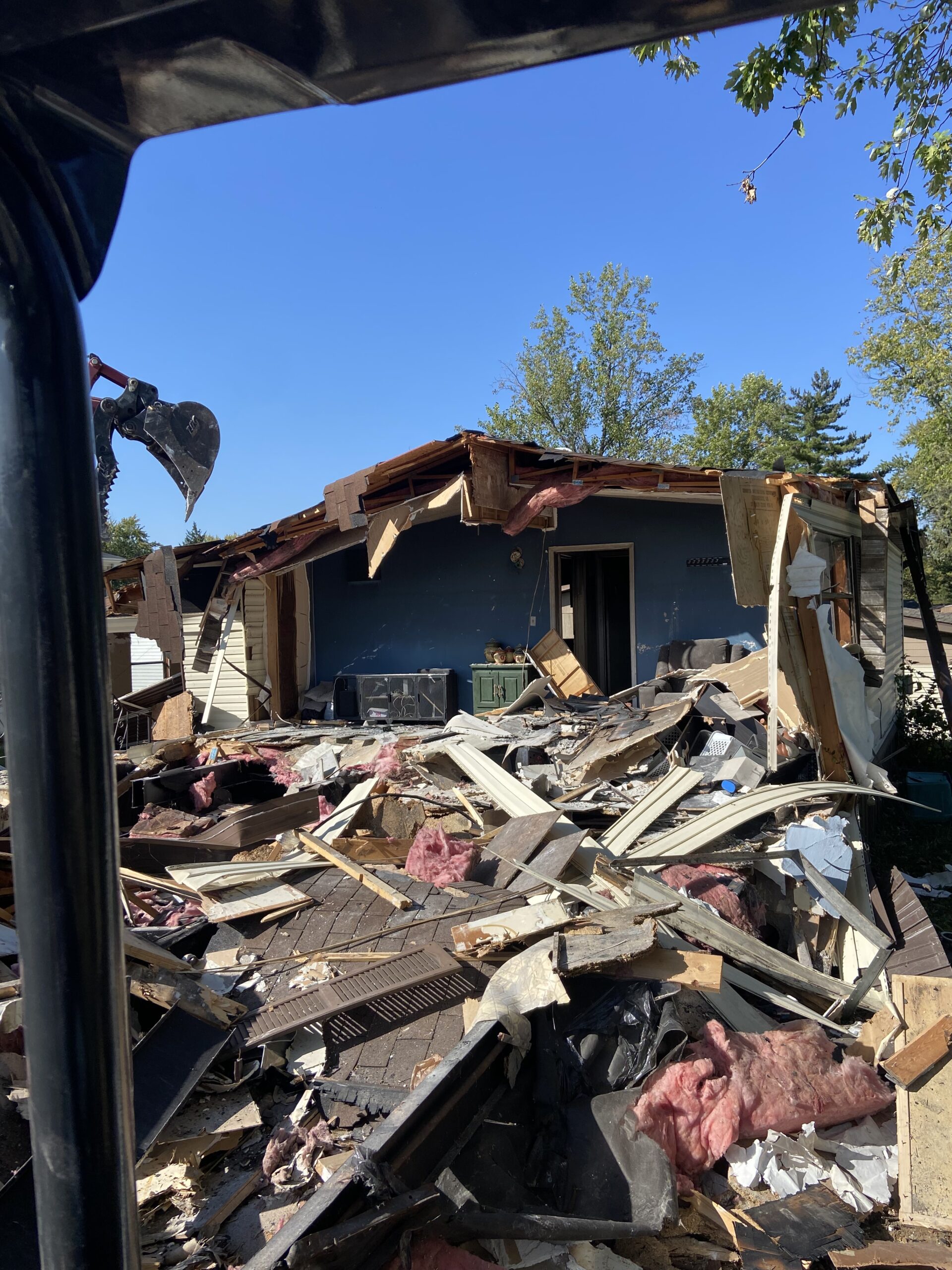 IMG_3097 Debris pile from a partially destroyed home.